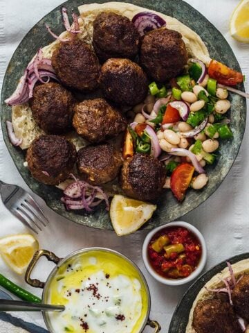 Homemade Turkish Meatballs served with bean salad and cucumber dip