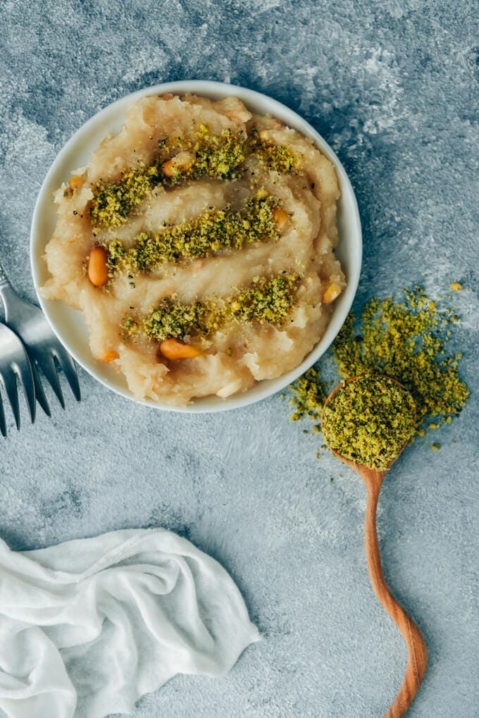 Turkish halva recipe with ground pistachio served on a white plate.