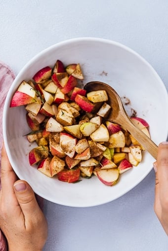 spiced apples in a white bowl