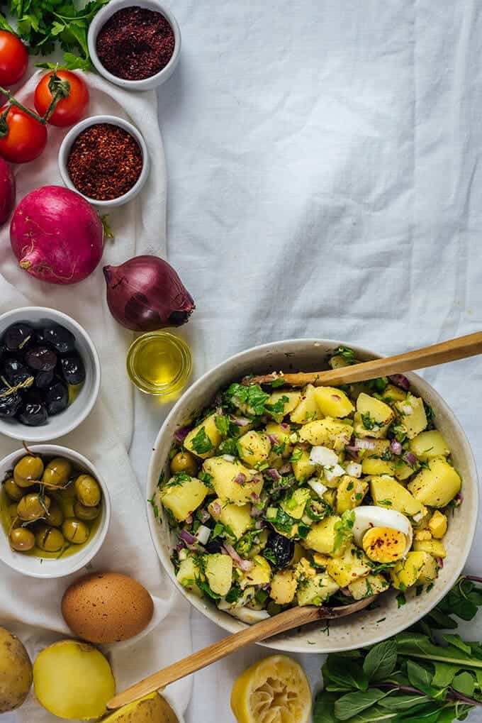 Turkish Potato Salad with herbs and hard-boiled eggs is very light, healthy and refreshing yet so tasty with all the Mediterranean flavors. A little spicy and tangy, this salad is so different from traditional mayonnaise-based potato salads. Perfect for potlucks!