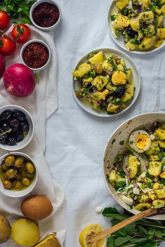 Turkish Potato Salad with herbs and hard-boiled eggs is very light, healthy and refreshing yet so tasty with all the Mediterranean flavors. A little spicy and tangy, this salad is so different from traditional mayonnaise-based potato salads. Perfect for potlucks!