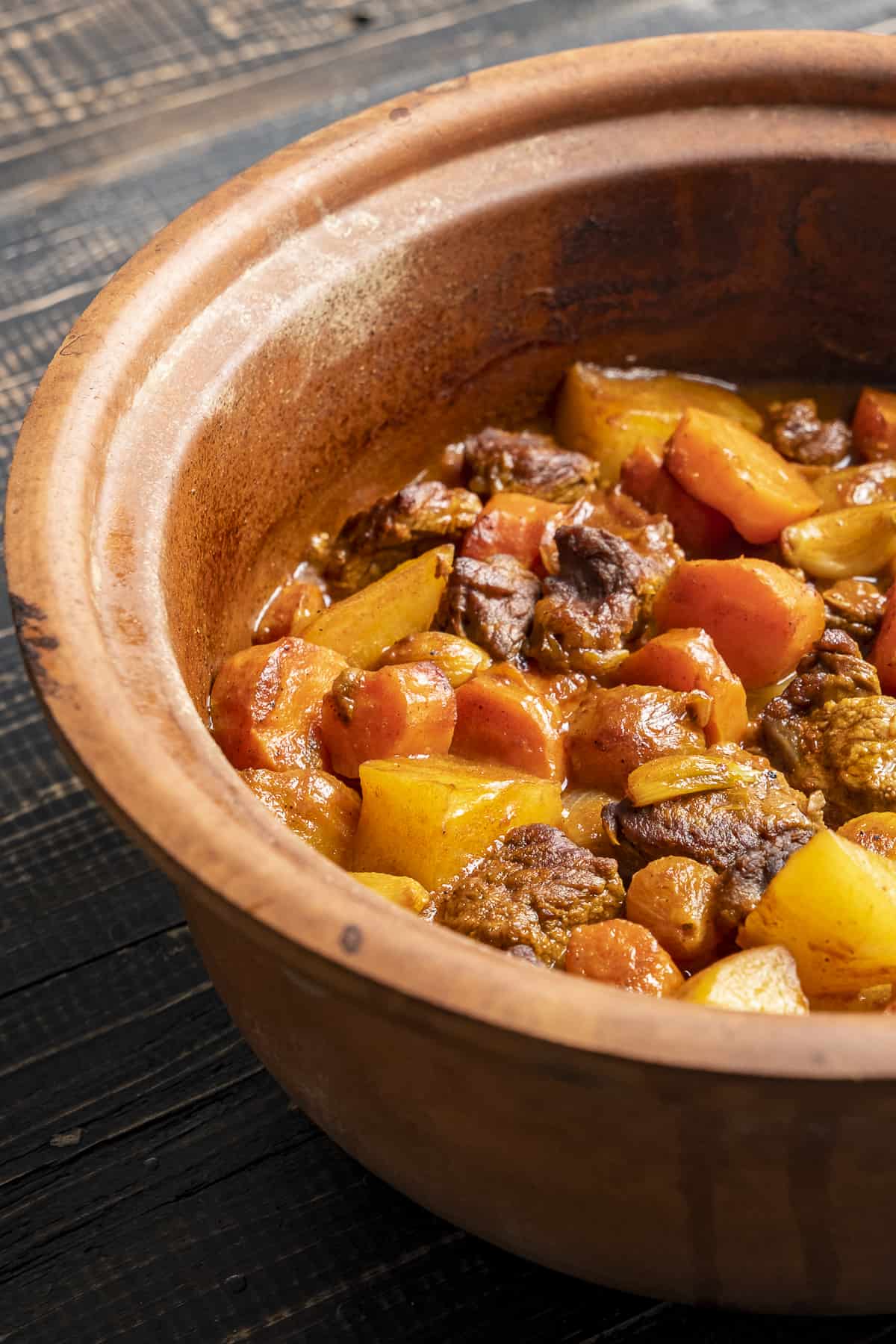 Guvec with meat and vegetables in an authentic earthenware pot.