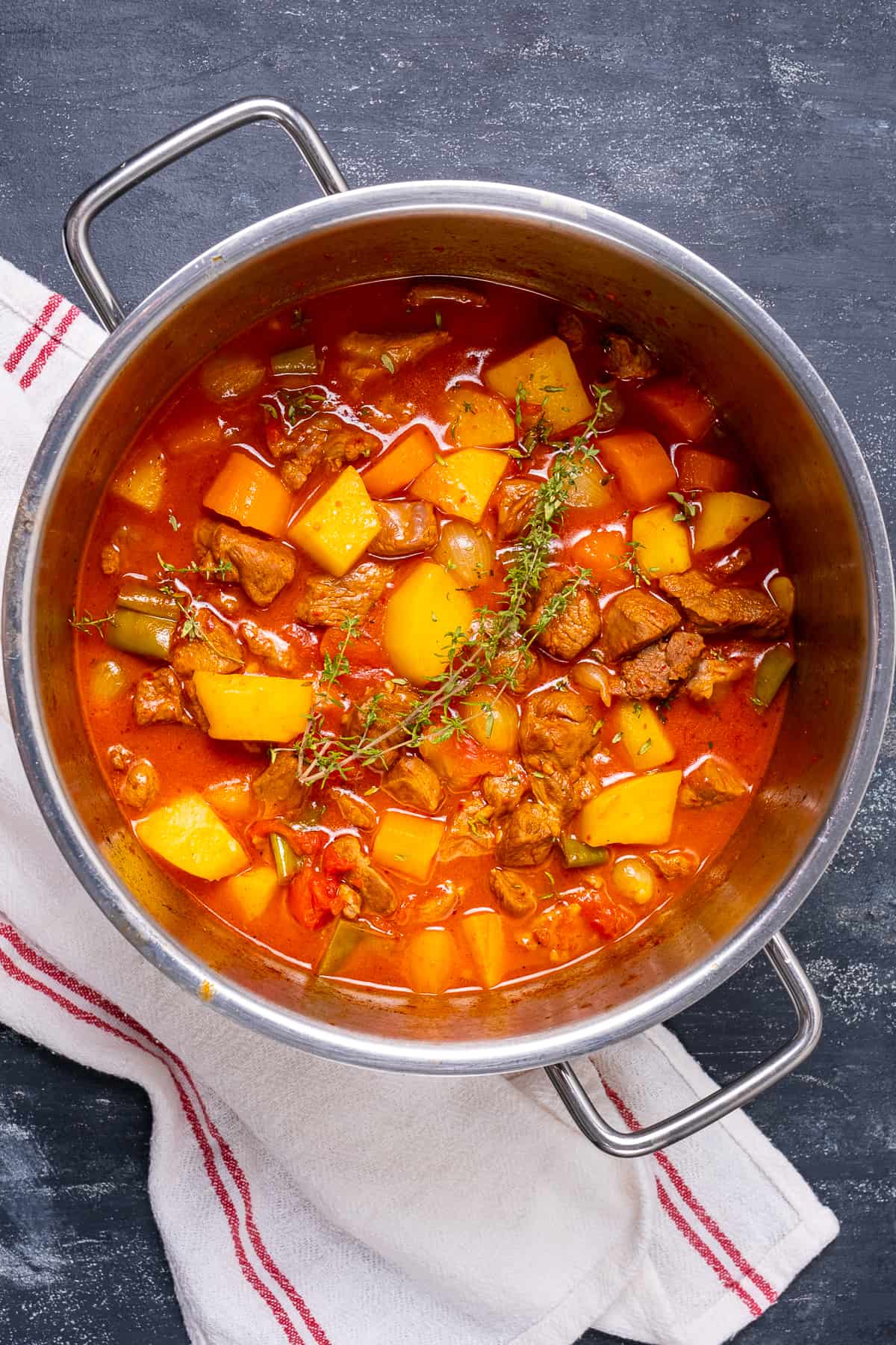 Lamb stew with potatoes and carrots in a pan.
