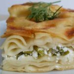 A slice of Turkish water borek stuffed with feta and parsley.