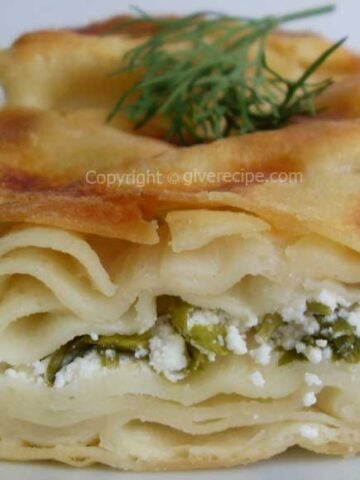 A slice of Turkish water borek stuffed with feta and parsley.