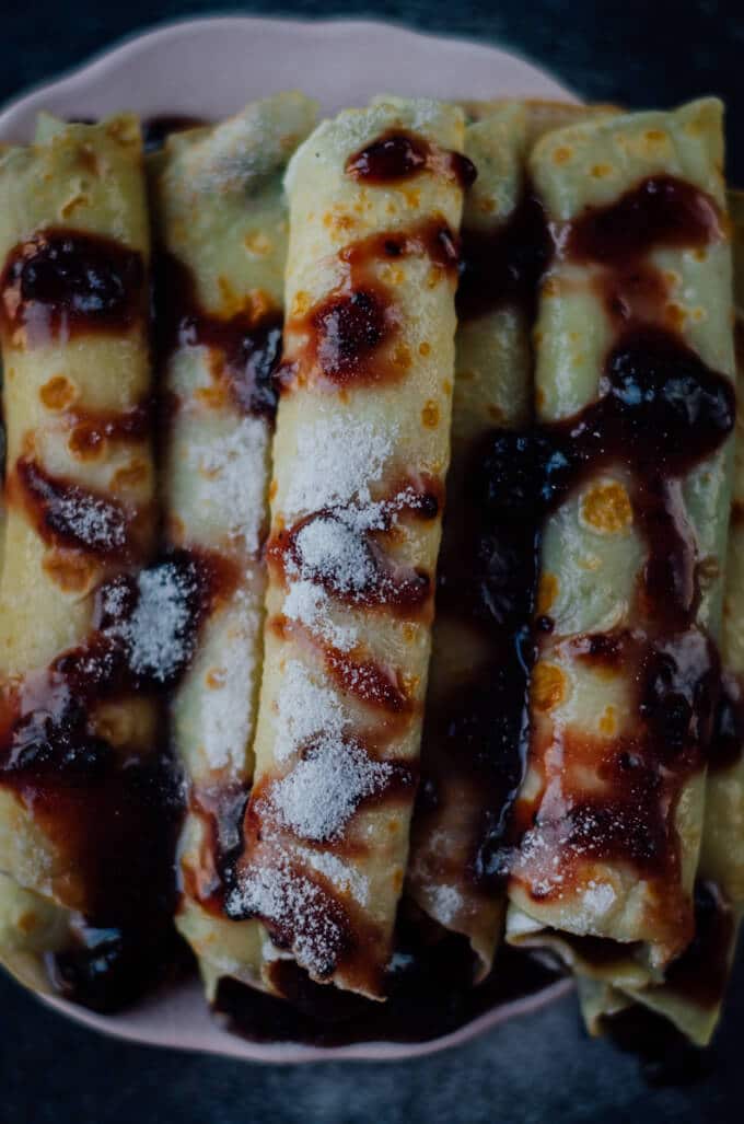 Crepes Filled with Jam can easily turn your breakfast to a feast. Are you saying you are not a breakfast person? Believe me you can’t say ‘no’ to breakfast with these festive looking crepes.