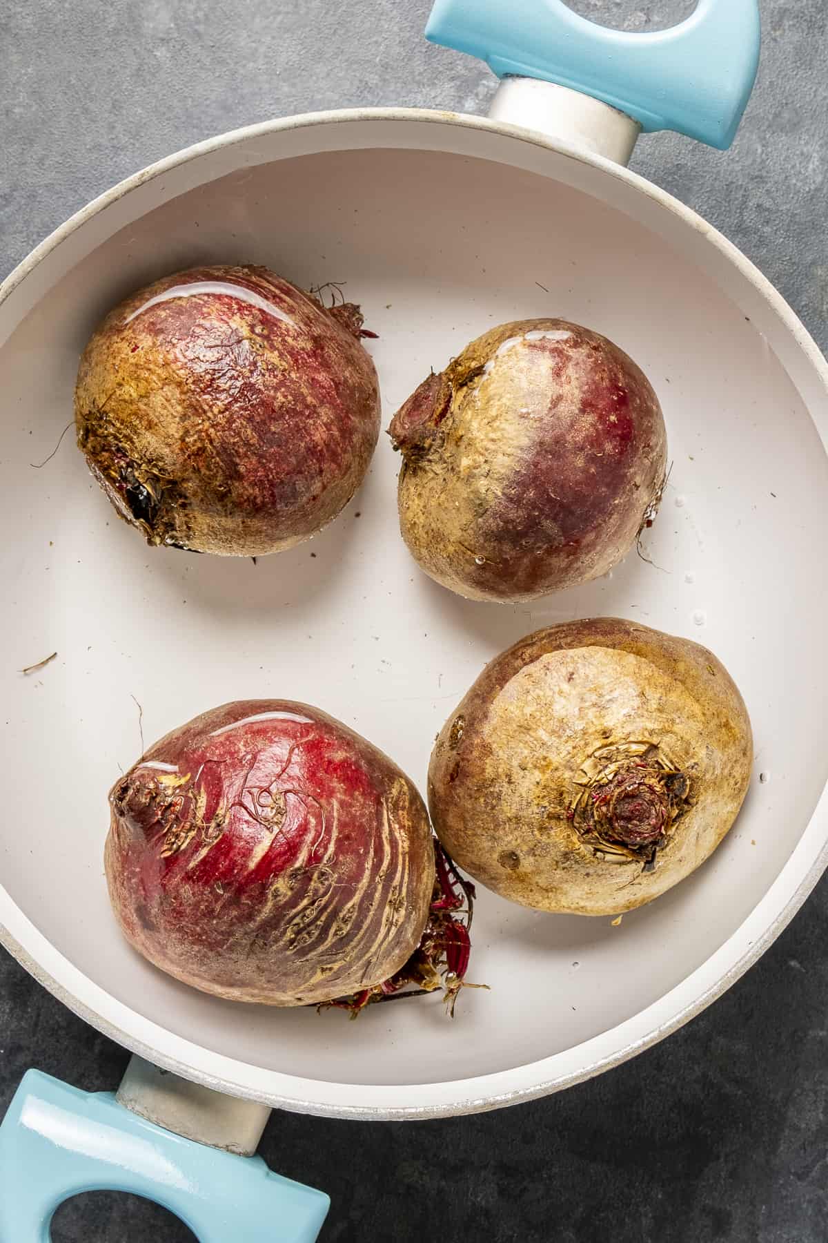 Beets in a pot filled with water.