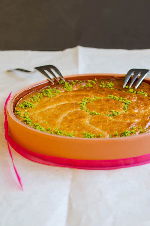 Sesame tahini halva melted in oven and garnished with pistachio.