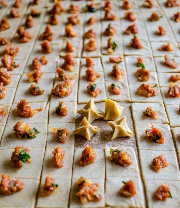 manti dough squares topped with ground lamb or beef