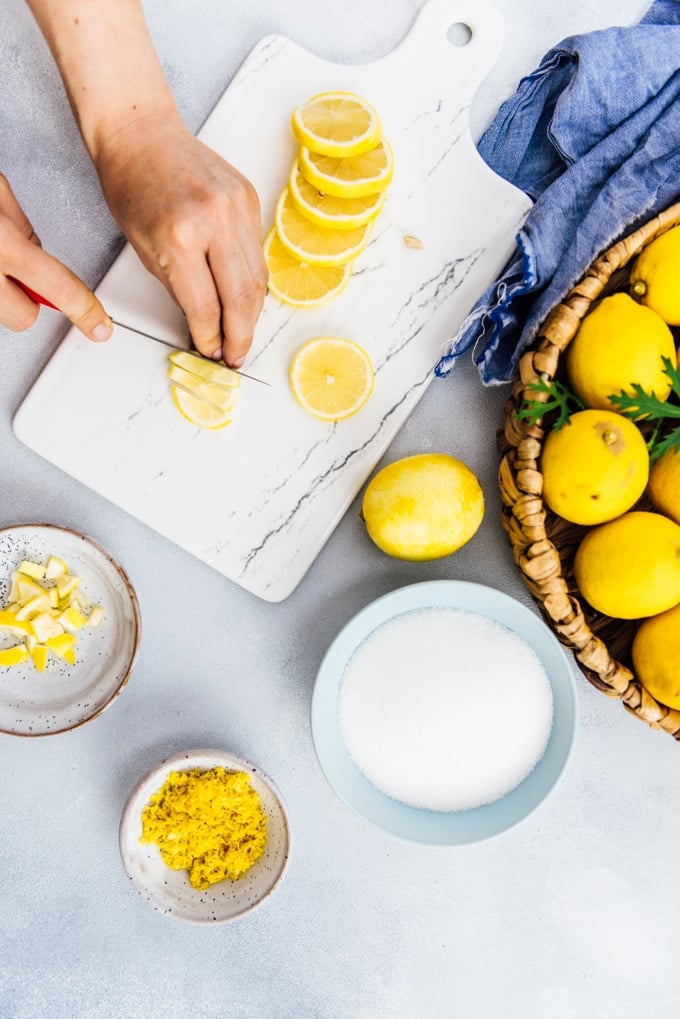 Woman chopping lemons to make lemon marmalade jam