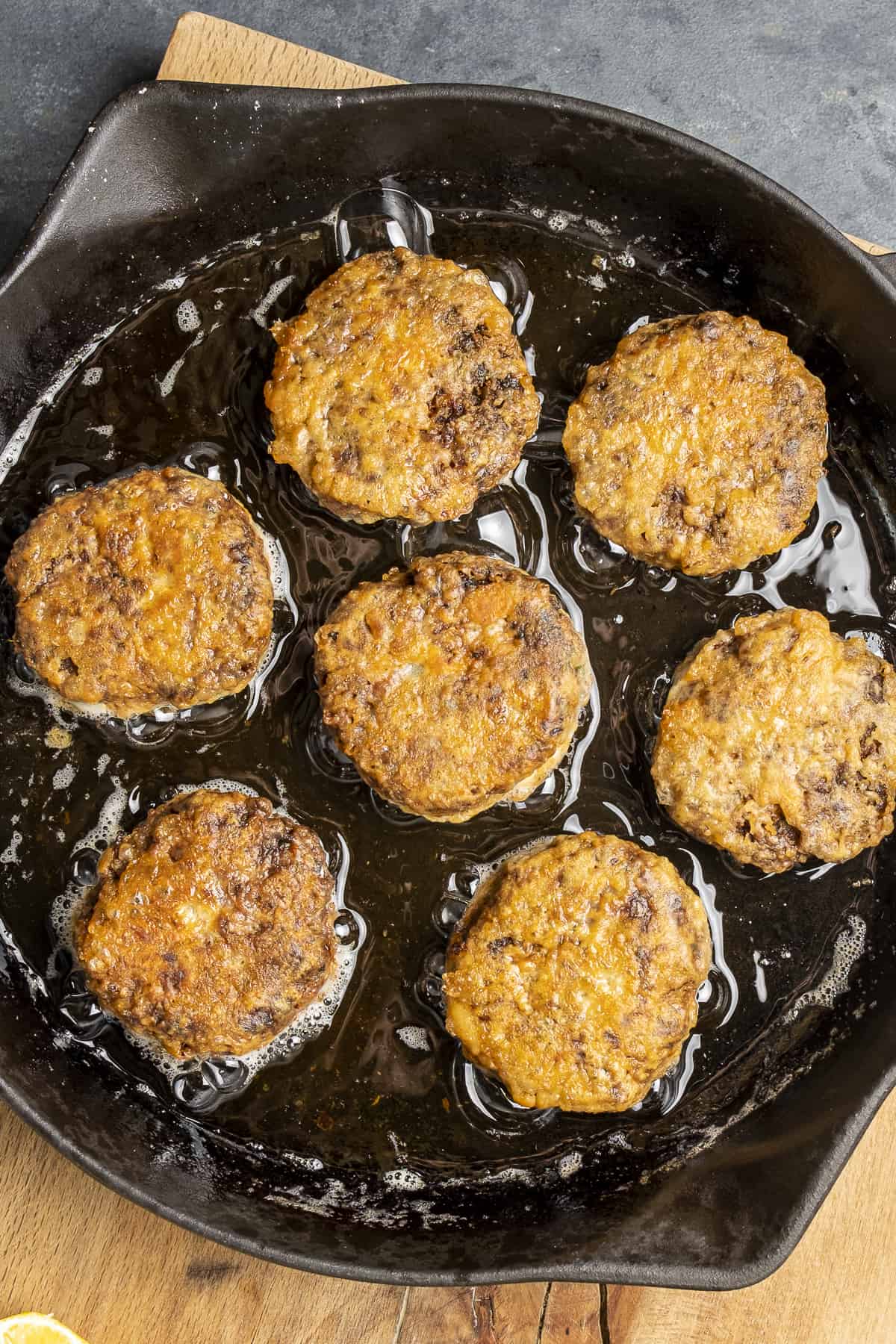 Kafinbudu meatballs frying in a cast iron.