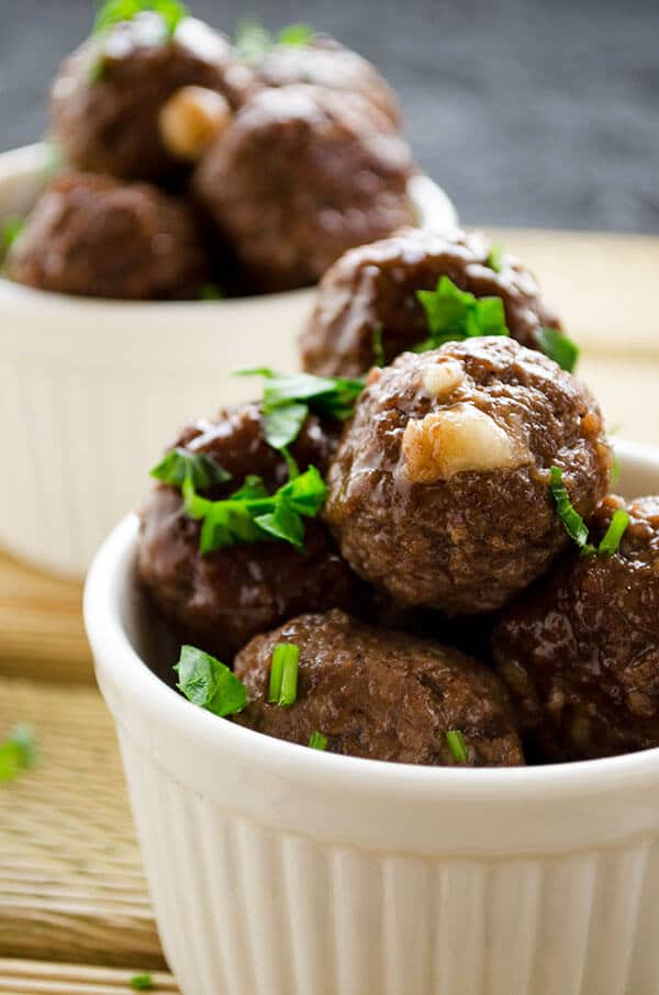 Cheese stuffed meatballs coated with honey and pomegranate molasses