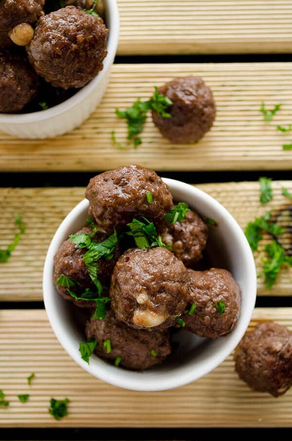 Cheese stuffed meatballs coated with honey and pomegranate molasses