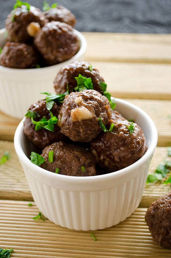 Cheese stuffed meatballs coated with honey and pomegranate molasses