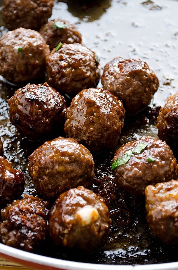 Cheese stuffed meatballs coated with honey and pomegranate molasses