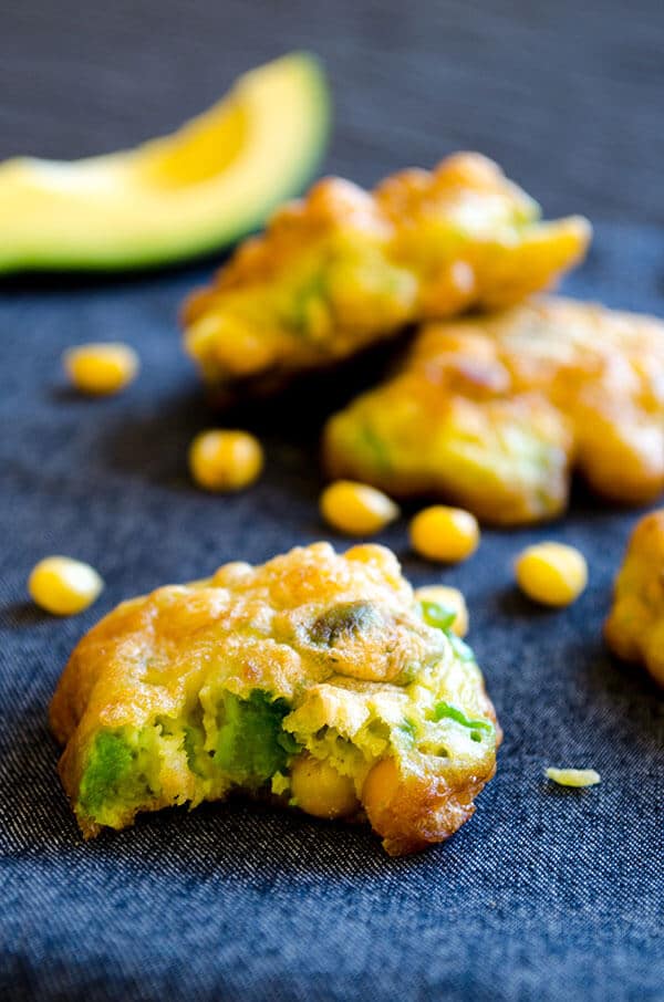 Gluten-free avocado corn fritters on grey linen