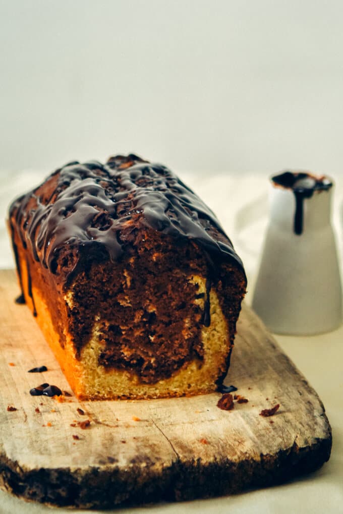 Marbled Chocolate Banana Bread topped with a silky chocolate ganache gives you the feeling of an amazingly light and moist chocolate cake. If you love chocolate and banana flavors together, you will LOVE this! Decadent and easy to make!