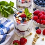 Yogurt parfait with berries in glass cups.