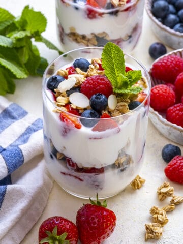 Yogurt parfait with berries in glass cups.