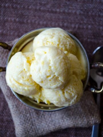 Creamy lemon ice cream loaded with lemon zest and lemon juice. The best refreshing summer treat for lemon lovers.