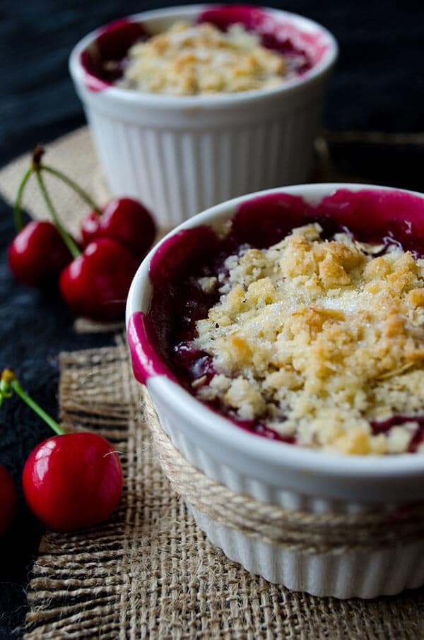 Fresh Cherry Crisp in white ramekins