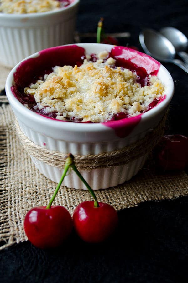 Fresh Cherry Crisp in white ramekins