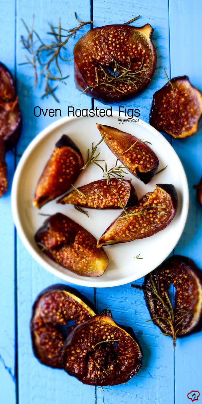 Oven roasted figs with rosemary on a white plate