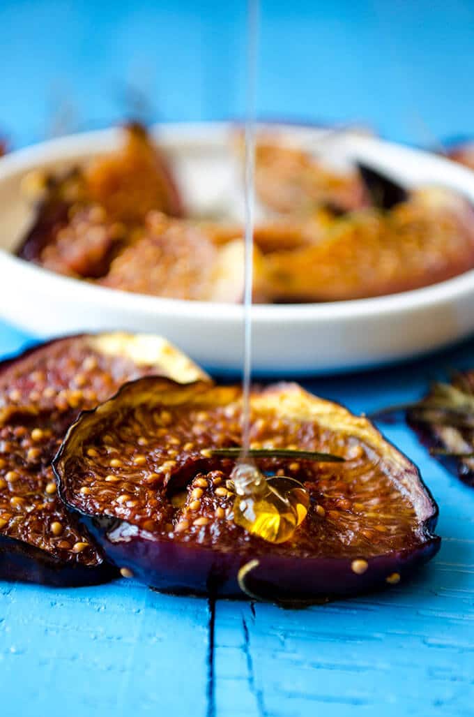 Drizzling honey on baked figs