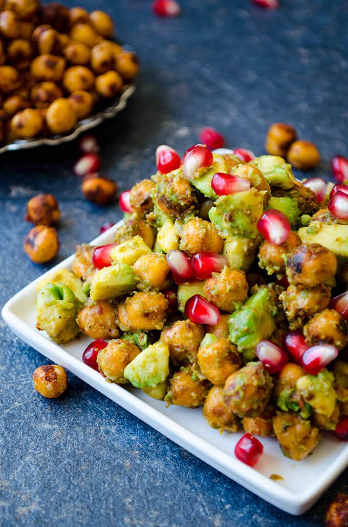 Avocado Chickpea Salad with pomegranate seeds is packed with flavors. Spicy, tangy and addictive! This is a scrumptious gluten free and vegan side dish you can eat even as a snack. 