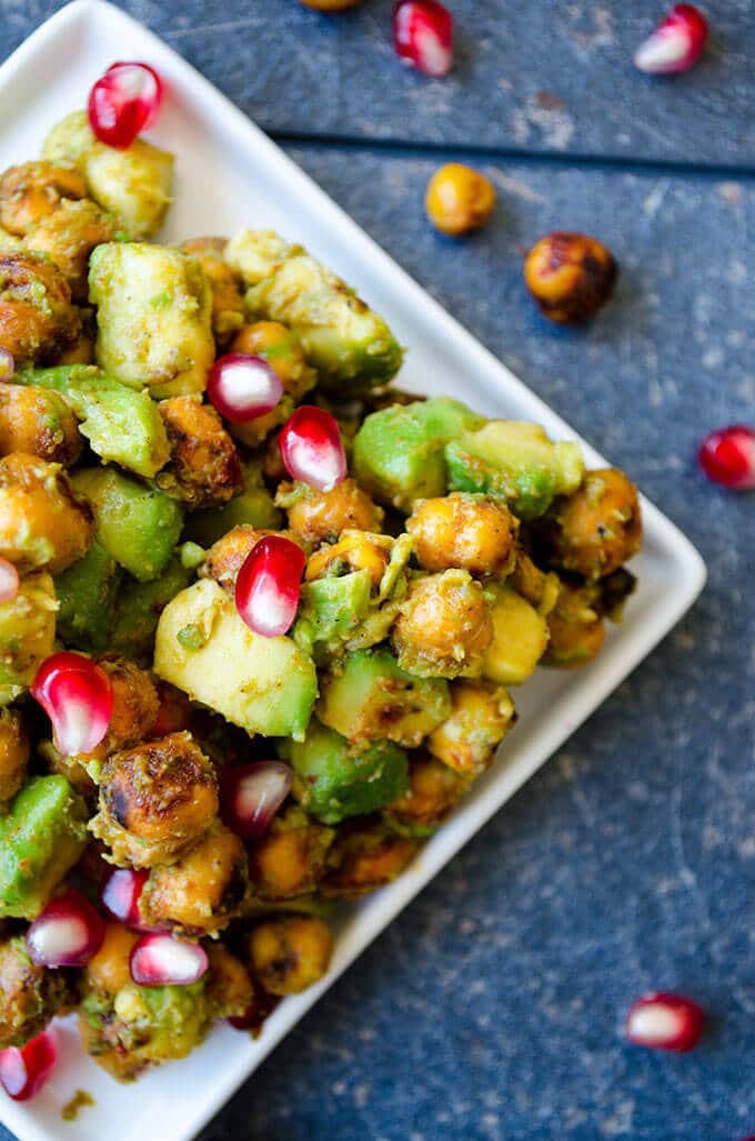 Avocado Chickpea Salad with pomegranate seeds is packed with flavors. Spicy, tangy and addictive! This is a scrumptious gluten free and vegan side dish you can eat even as a snack. 
