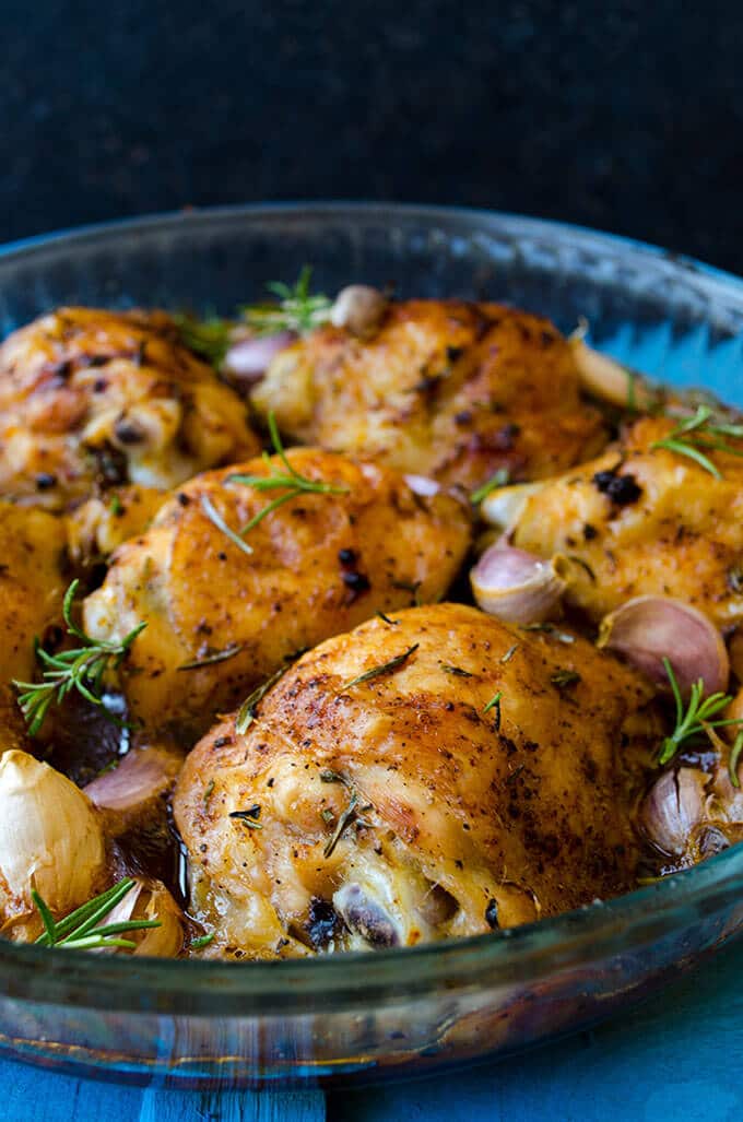 Roasted Chicken Pieces are simple and so easy to make. Coated with olive oil, seasoned with salt and black pepper, flavored with garlic and rosemary. Prepare these in 5 minutes and forget them in the oven for about 50 minutes. #chickenparts #roastedchickenpieces #chickenrecipe Simple Roasted Chicken Pieces with garlic and rosemary
