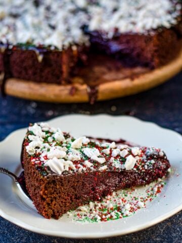 A slice of chocolate beet cake on a white plate.