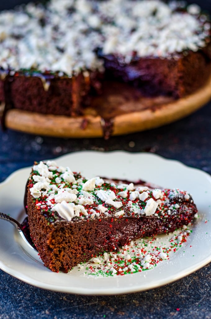 A slice of chocolate beet cake on a white plate.