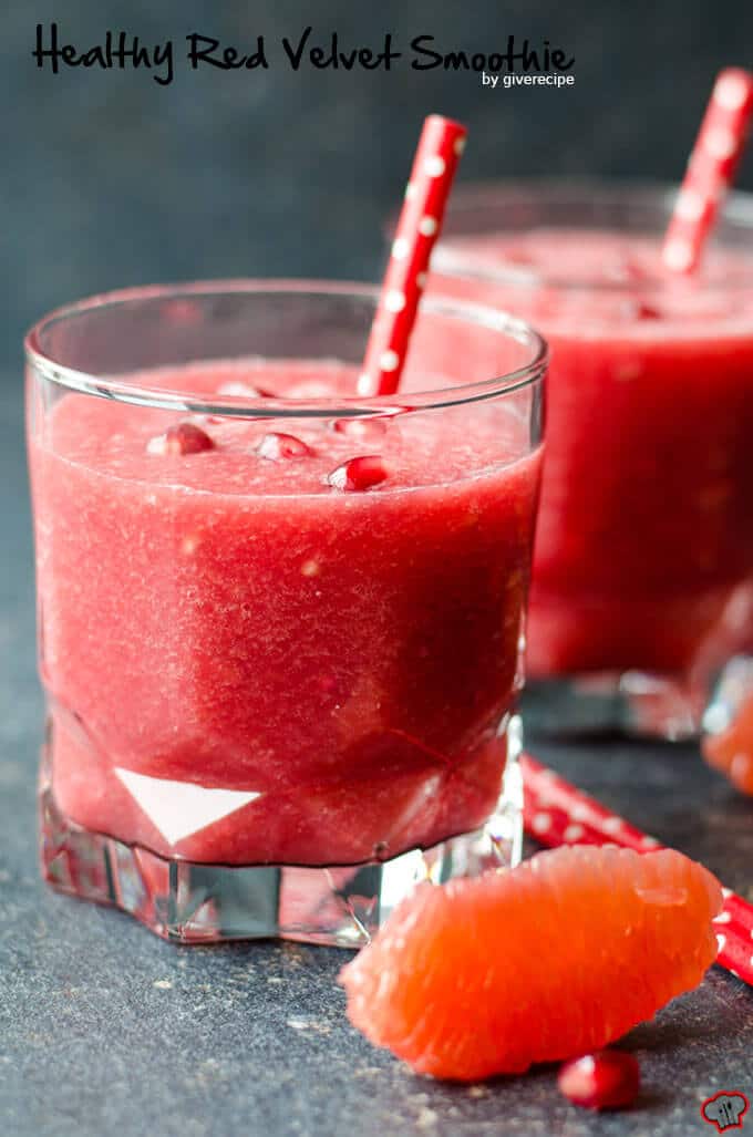 Healthy Red Velvet Grapefruit Smoothie is a real immune system booster. Packed with refreshing citrus fruit and pomegranate. No sugar or food coloring is added. Energizes your body. #healthysmoothie #grapefruitsmoothie #valentinesdaybreakfast Healthy Grapefruit Smoothie with pomegranate arils and red straw