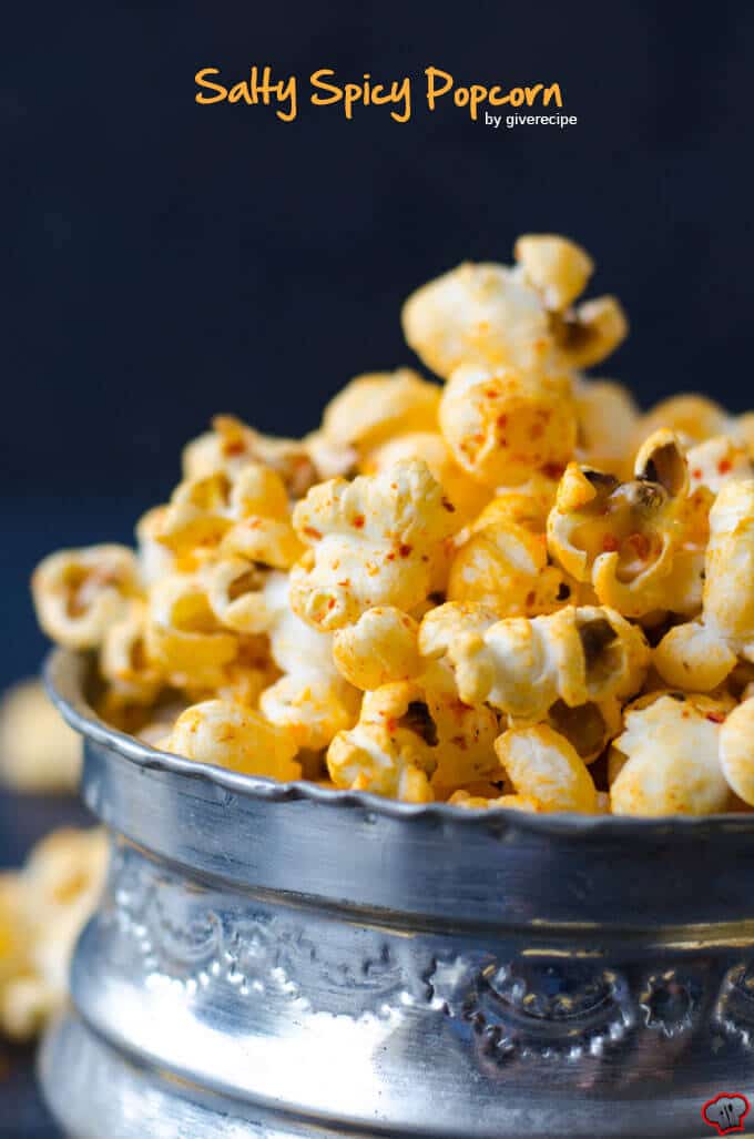 Homemade stovetop popcorn seasoned with chili powder, black pepper and cumin. #spicypopcorn #homemadepopcorn #howtomakepopcorn Salty Spicy Popcorn in a copper bowl