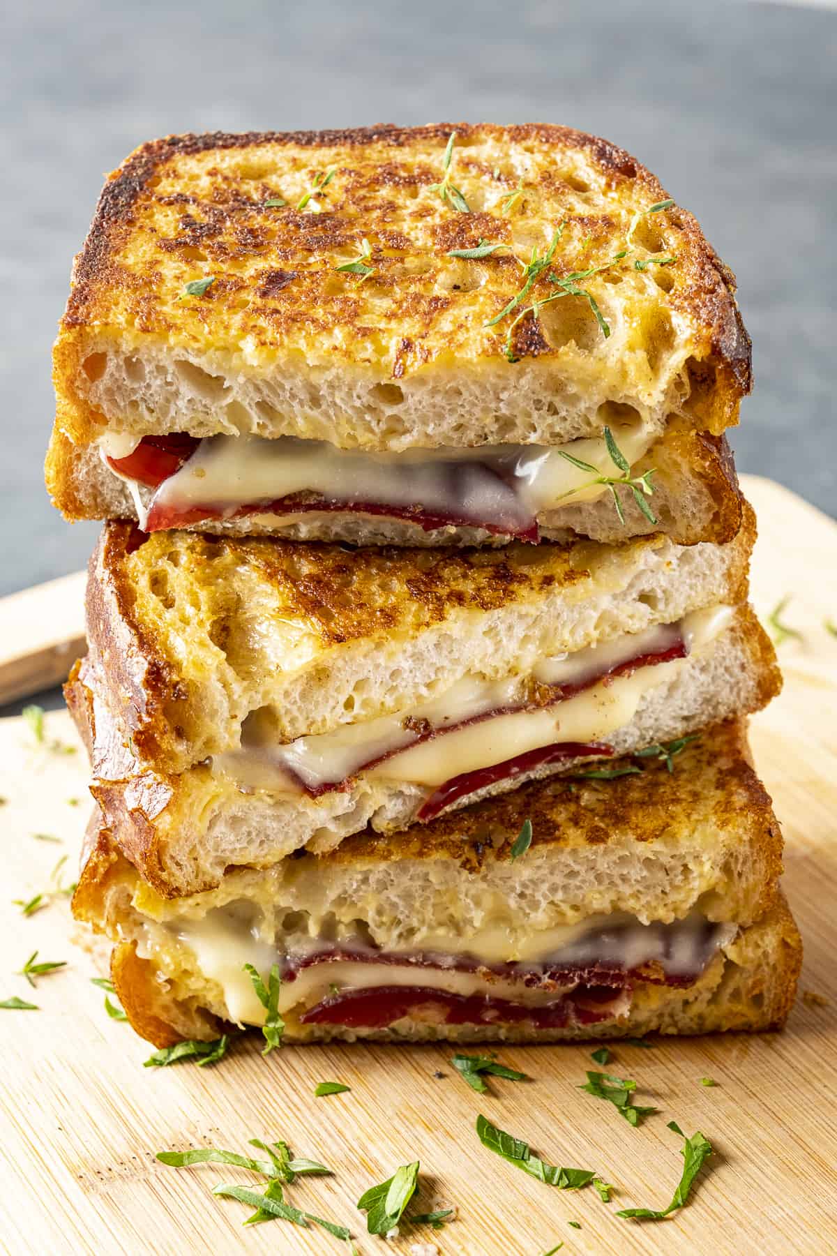 Grilled cheese breakfast sandwiches put on one another.