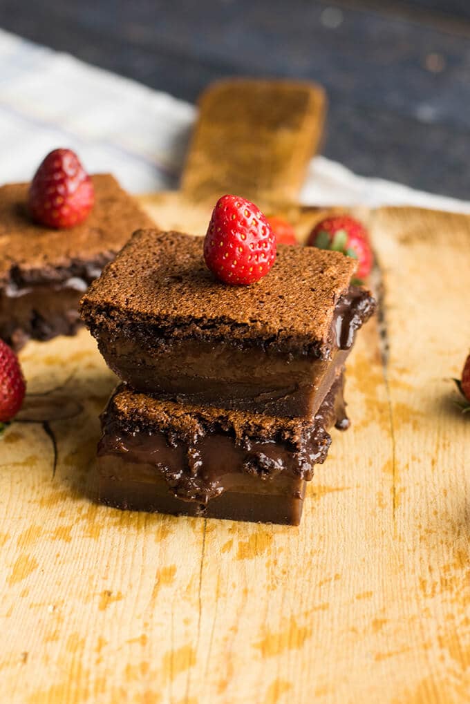 Gluten-free chocolate magic cake on a wooden board