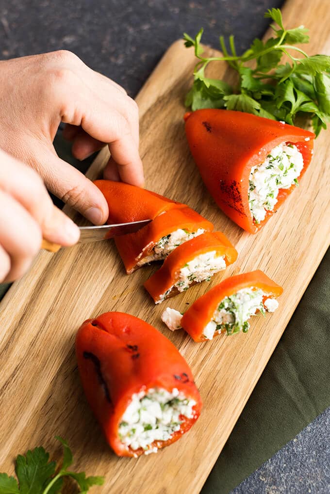 Feta Stuffed Red Bell Peppers make perfect appetizers for parties. Roasted red bell peppers are filled with a mixture of feta and greek yogurt. - giverecipe.com