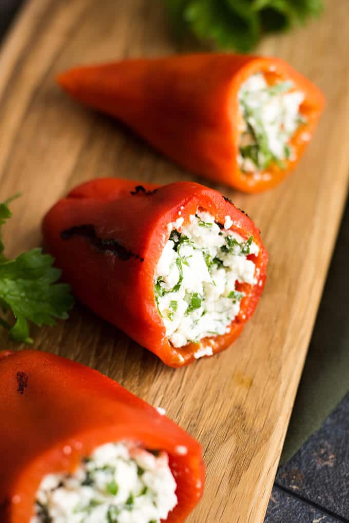 Feta Stuffed Red Bell Peppers make perfect appetizers for parties. Roasted red bell peppers are filled with a mixture of feta and greek yogurt. - giverecipe.com