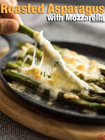 Roasted Asparagus with Mozzarella can tempt anyone. This is always the winner at parties. Simple yet addictive! - giverecipe.com