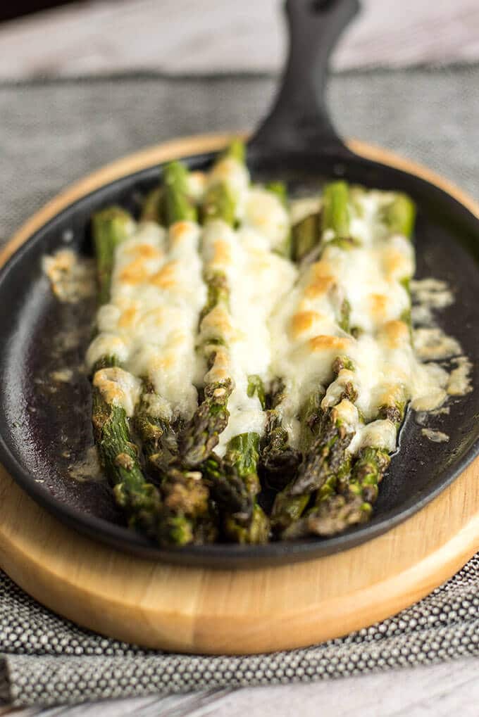 Roasted Asparagus with Mozzarella can tempt anyone. This is always the winner at parties. Simple yet addictive! - giverecipe.com 