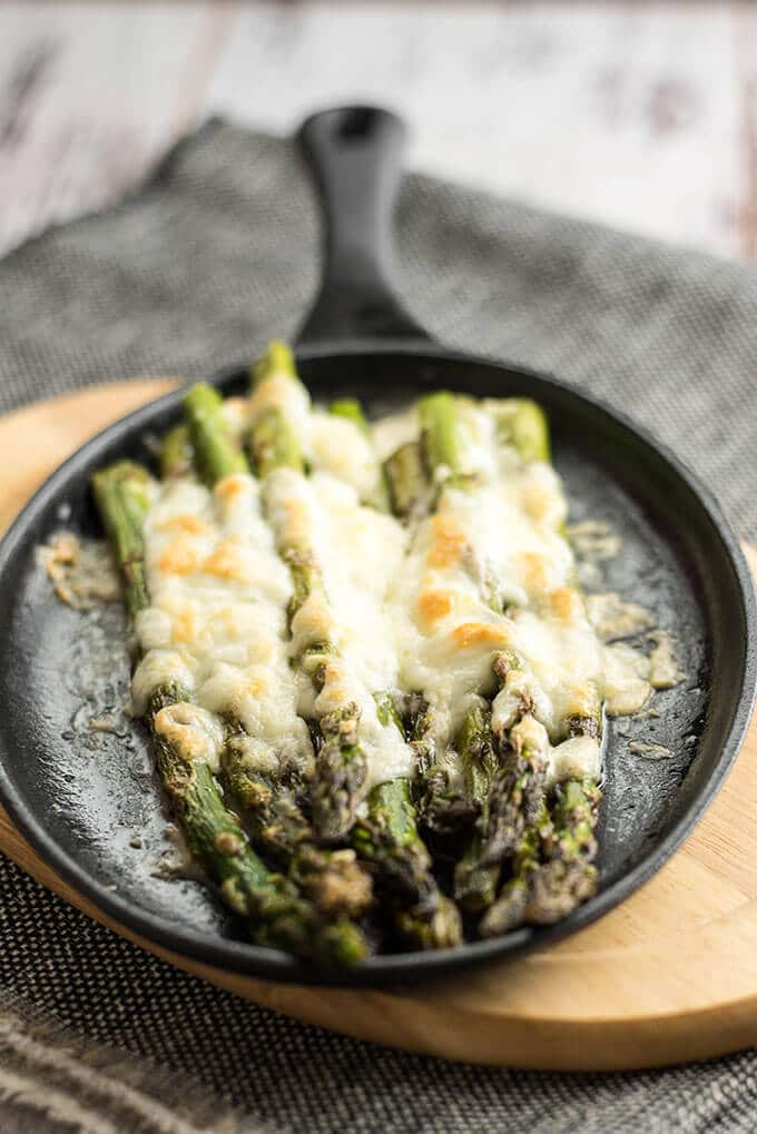 Roasted Asparagus with Mozzarella can tempt anyone. This is always the winner at parties. Simple yet addictive! - giverecipe.com 