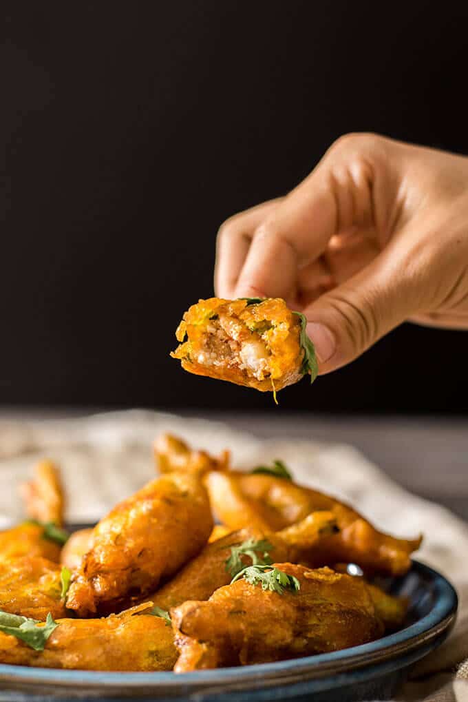 Zucchini blossoms stuffed with cooked shrimps and cheese. Battered and deep fried. These are TO DIE FOR! Disappear in a minute! - giverecipe.com