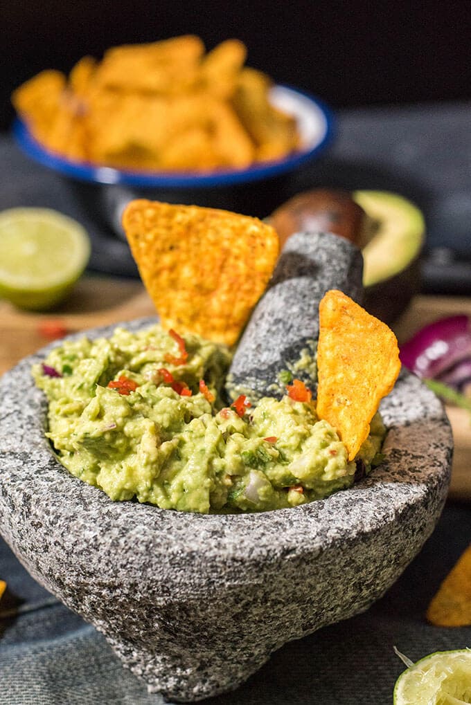 This is my BEST guacamole ever. Spicy without jalapenos. You will love the heat coming from red chilies in it. #guacamolerecipe #spicyguacamole #bestguacamole How to make spicy guacamole without jalapenos