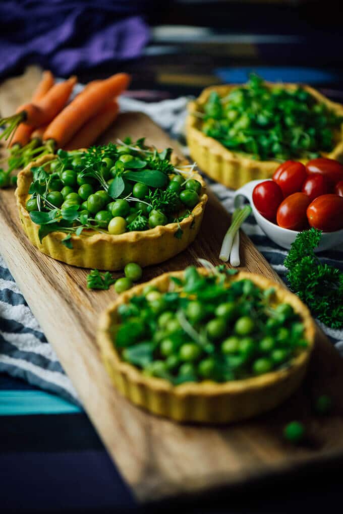 Savory tart recipe with a cheese filling, peas and herbs