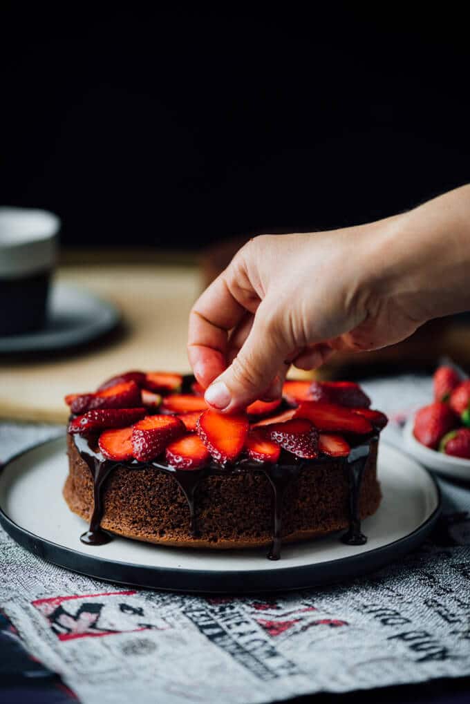 Filling a chocolate cake with the easiest strawberry cake filling and chocolate ganache