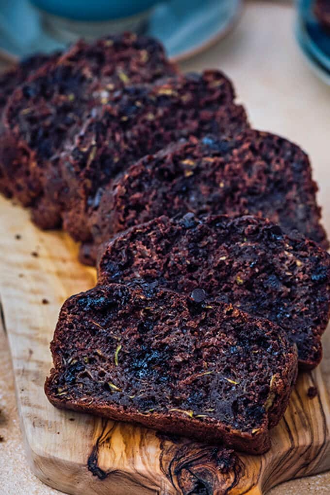 Chocolate zucchini bread sliced on a wooden board