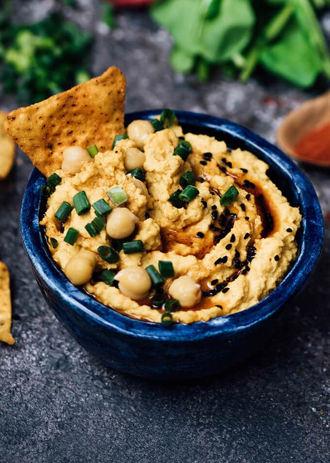 Spicy Pumpkin Hummus in a blue bowl.