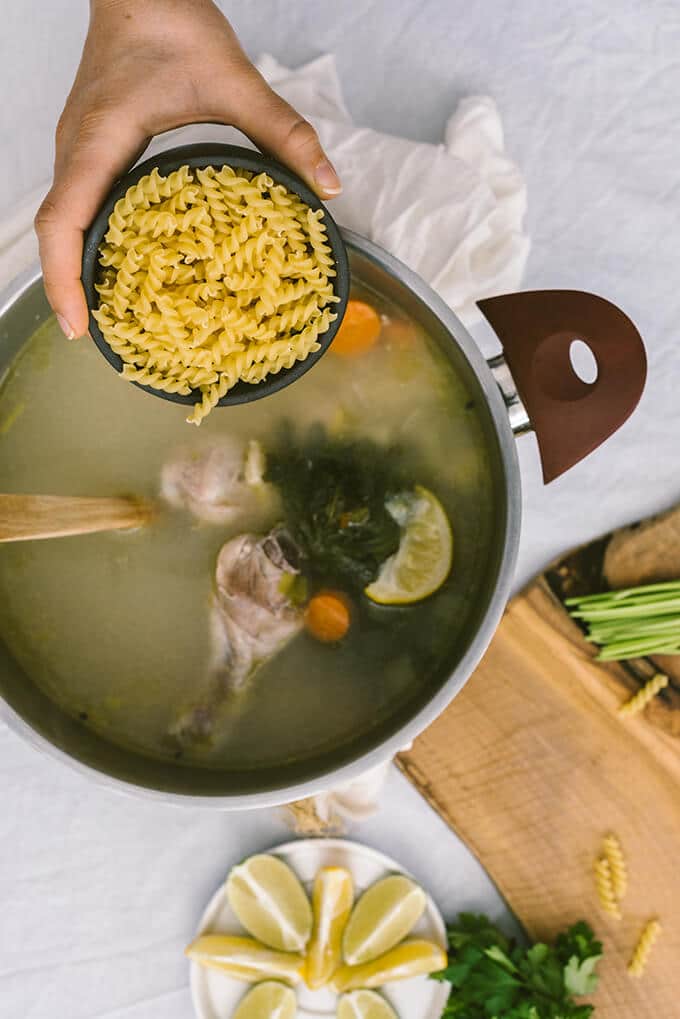 Adding pasta in chicken soup pot