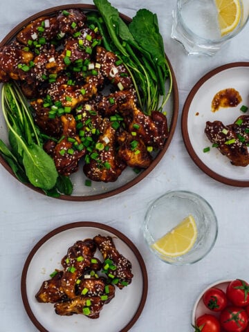 Sticky Baked Chicken Wings are so addictive with their sweet, tangy and spicy sauce. It’s so hard to stop eating these when they are double-dipped into the sauce.